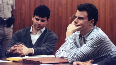 Erik Menendez (R) and brother Lyle listen to court proceedings during a 1991 court appearance.